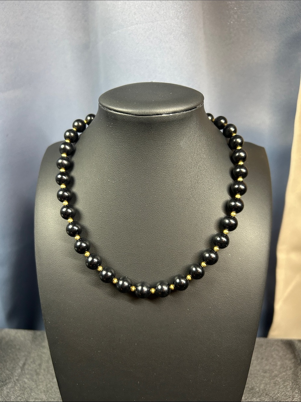 Vintage Monet black beaded necklace with gold-tone spacer beads